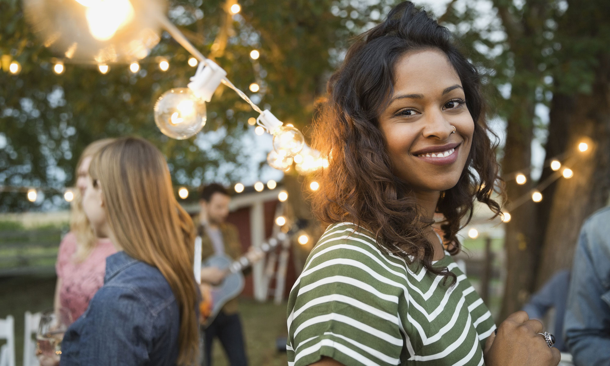 Smiling woman at an outdoor party